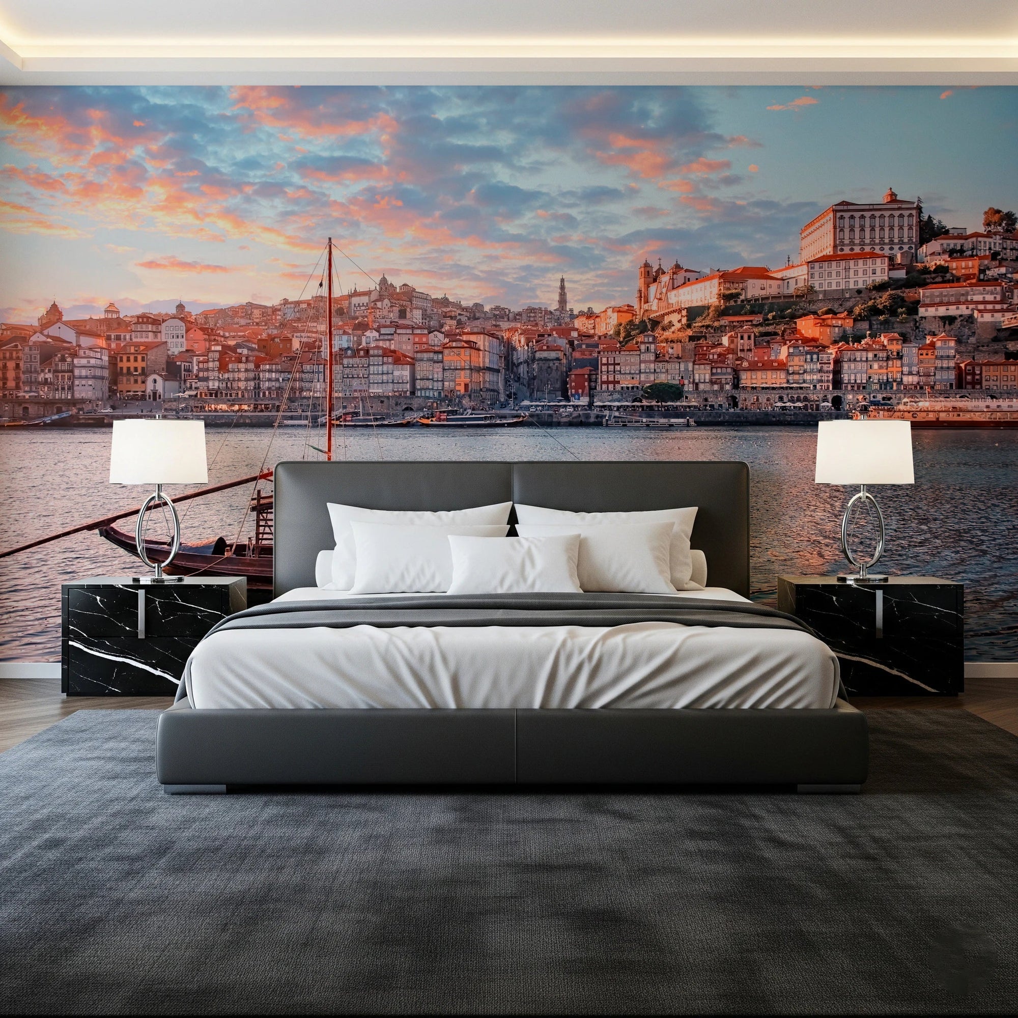 Porto Sunset Glow wallpaper mural of the Douro riverfront at dusk behind a grey bed and black marble nightstands