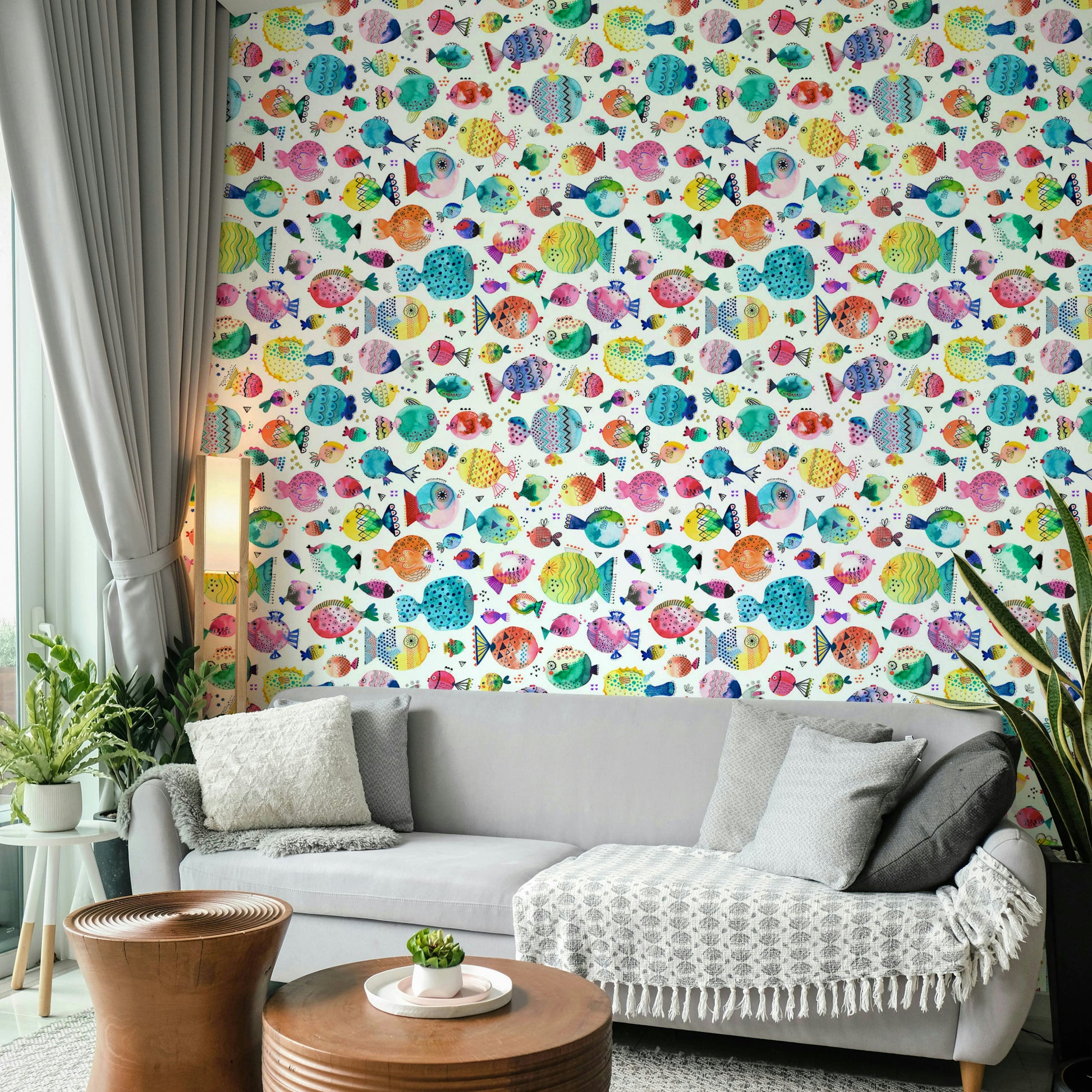 Child-friendly wallpaper with bubbly puffer fish and marine plants.

