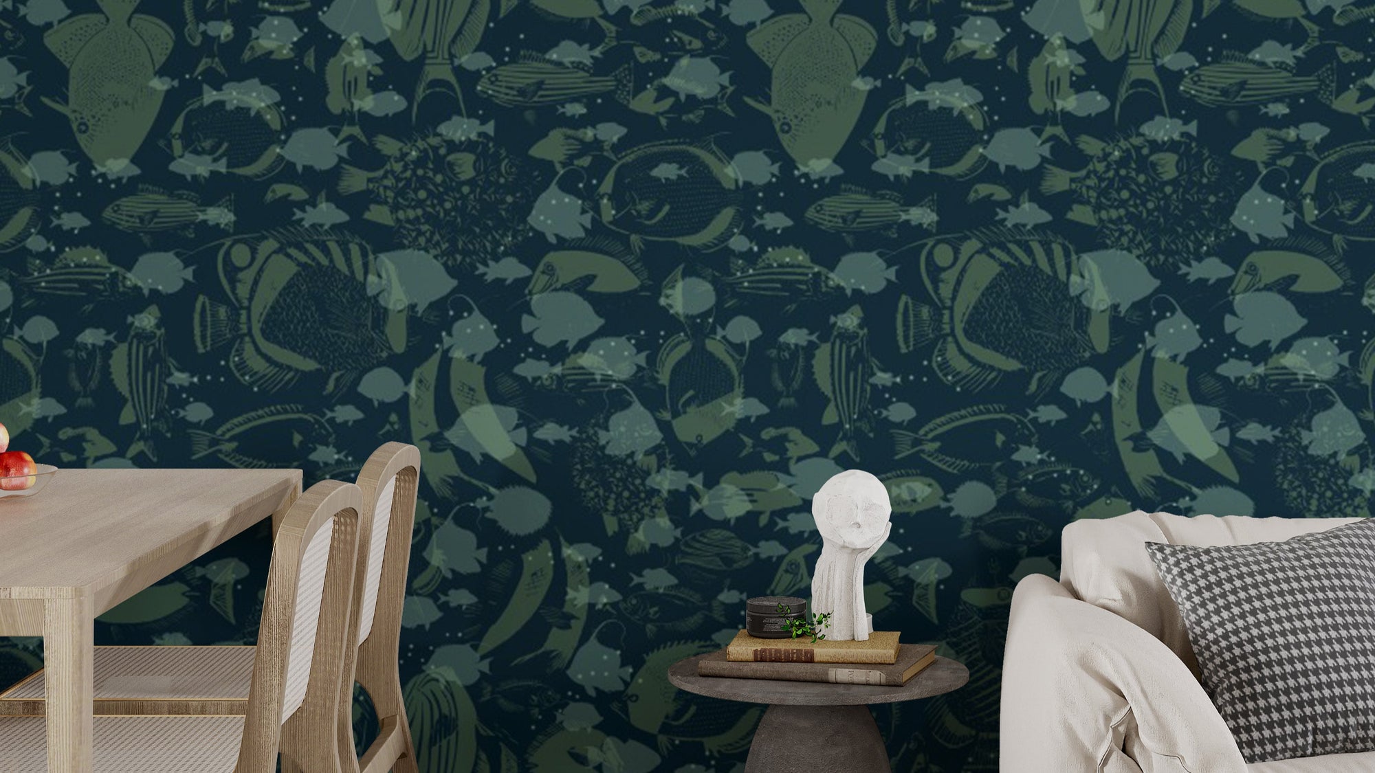 Abyssal Swirl wallpaper mural in dark navy with green fish silhouettes behind a light wood dining table and beige sofa