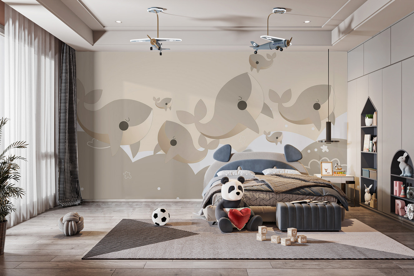 Whimsical whale pattern mural on canvas material in a kid's bedroom with a navy blue bed and scattered floor toys.