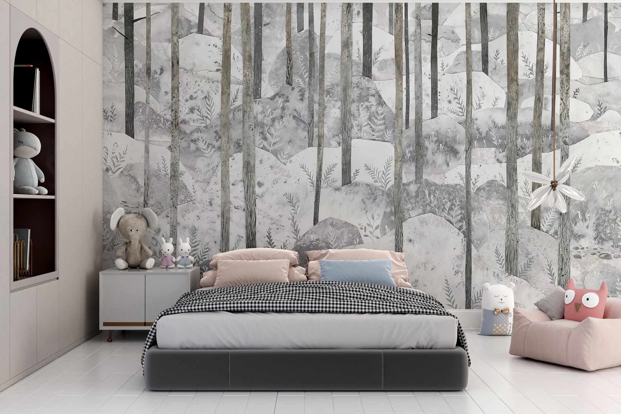 Frosty Fern Forest wallpaper mural in grey behind a kids bed with pink pillows and plush toys in a nursery