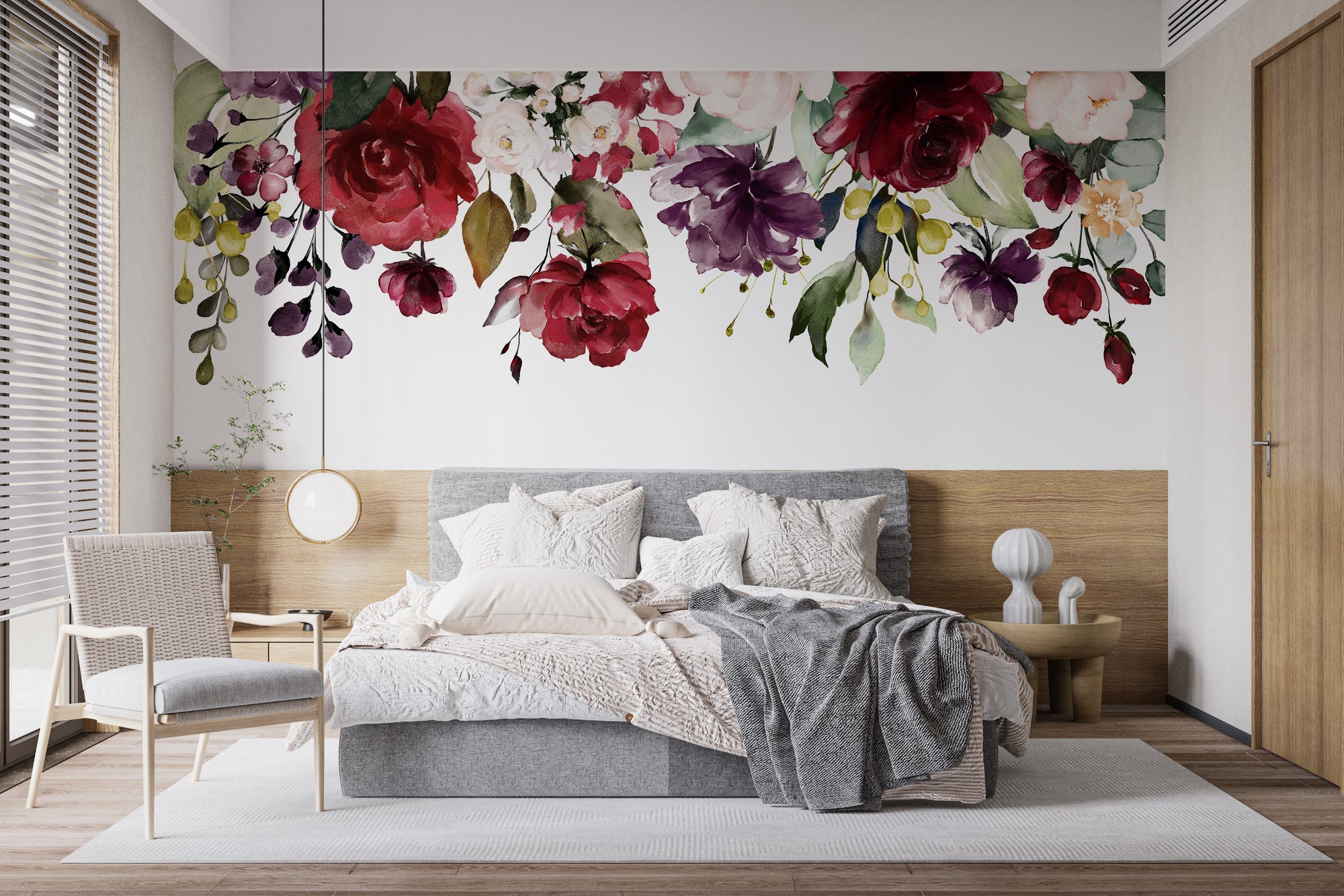 Red and Pink Floral wallpaper mural of cascading roses above a grey upholstered bed in a bedroom