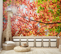 The mural shows a close-up of red and green foliage.

