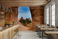 Rugged rock wall mural with blue sky
