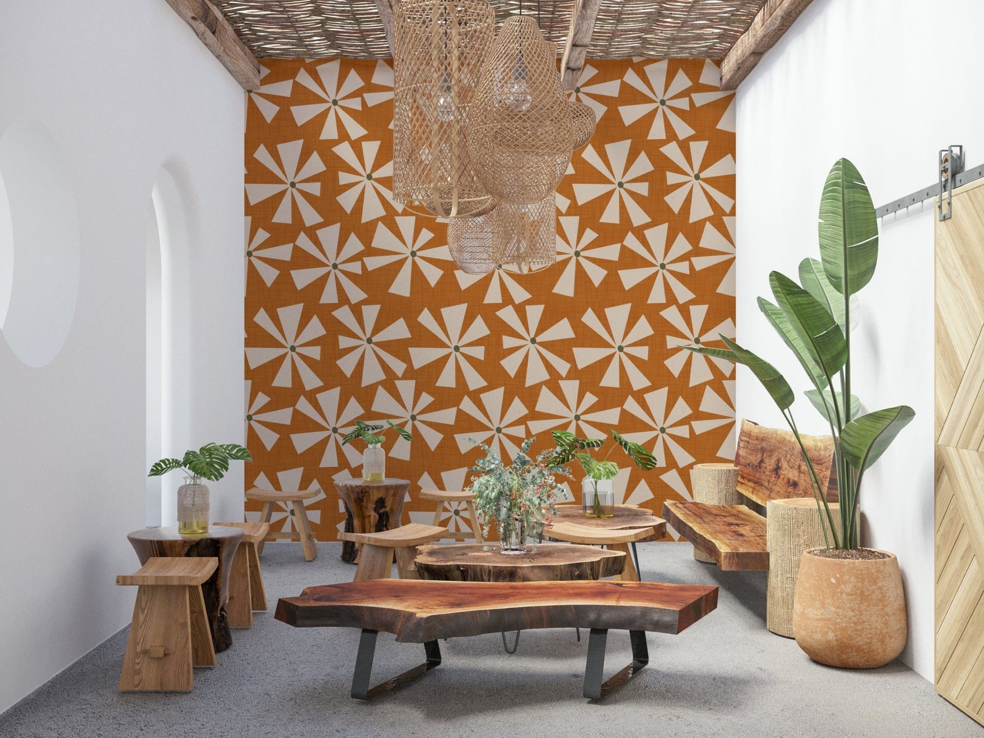 Decorative mid-century wallpaper featuring cream starburst blooms on a textured orange surface.