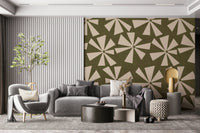 Bold retro burst wallpaper featuring radiating petal-like shapes arranged across a green field.