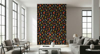 A patterned wallpaper with whimsical geometric stacks in bright colors set against a charcoal background.