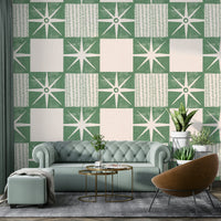 Simple retro starburst wallpaper in muted sage tones

