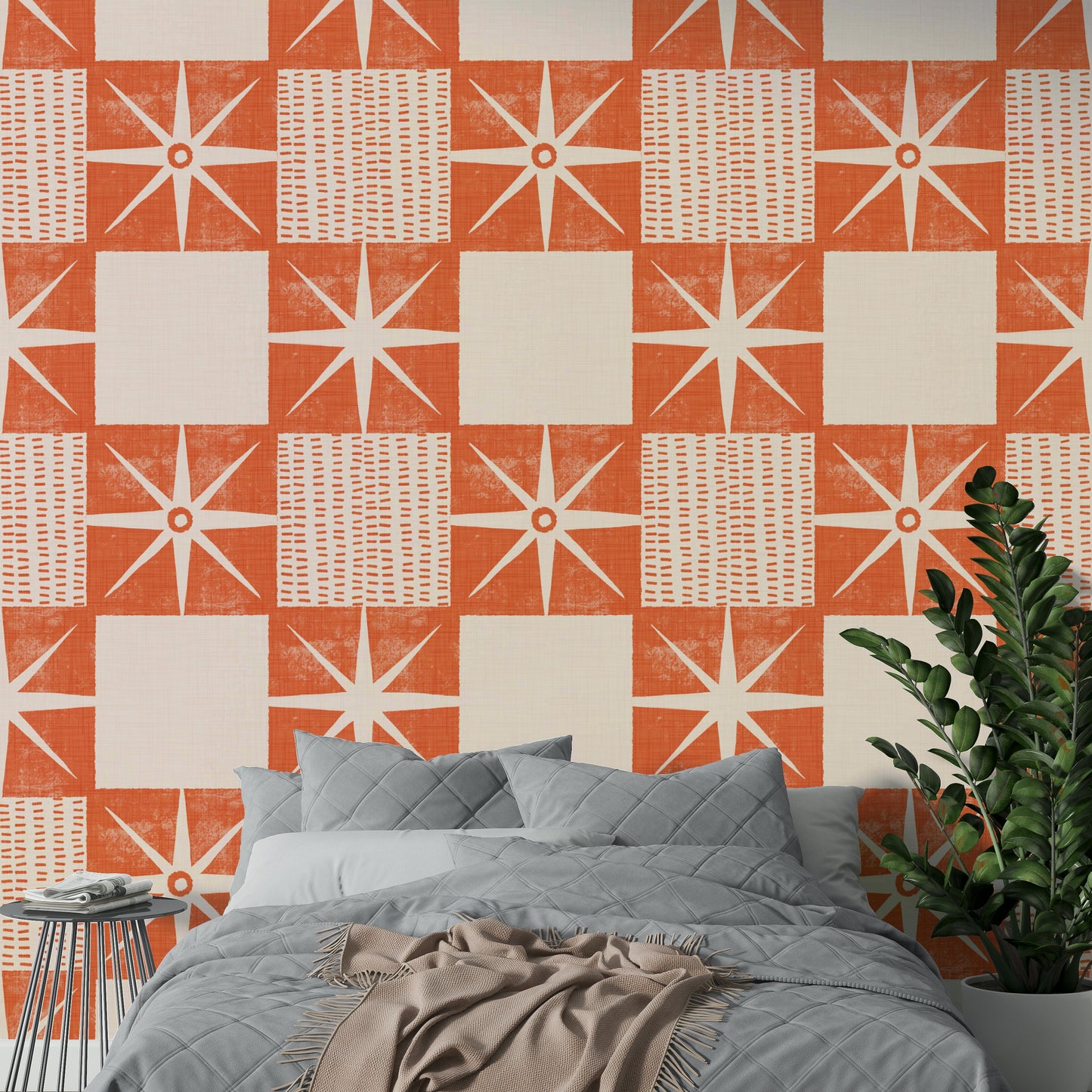 Mid-century starburst wallpaper in muted salmon orange

