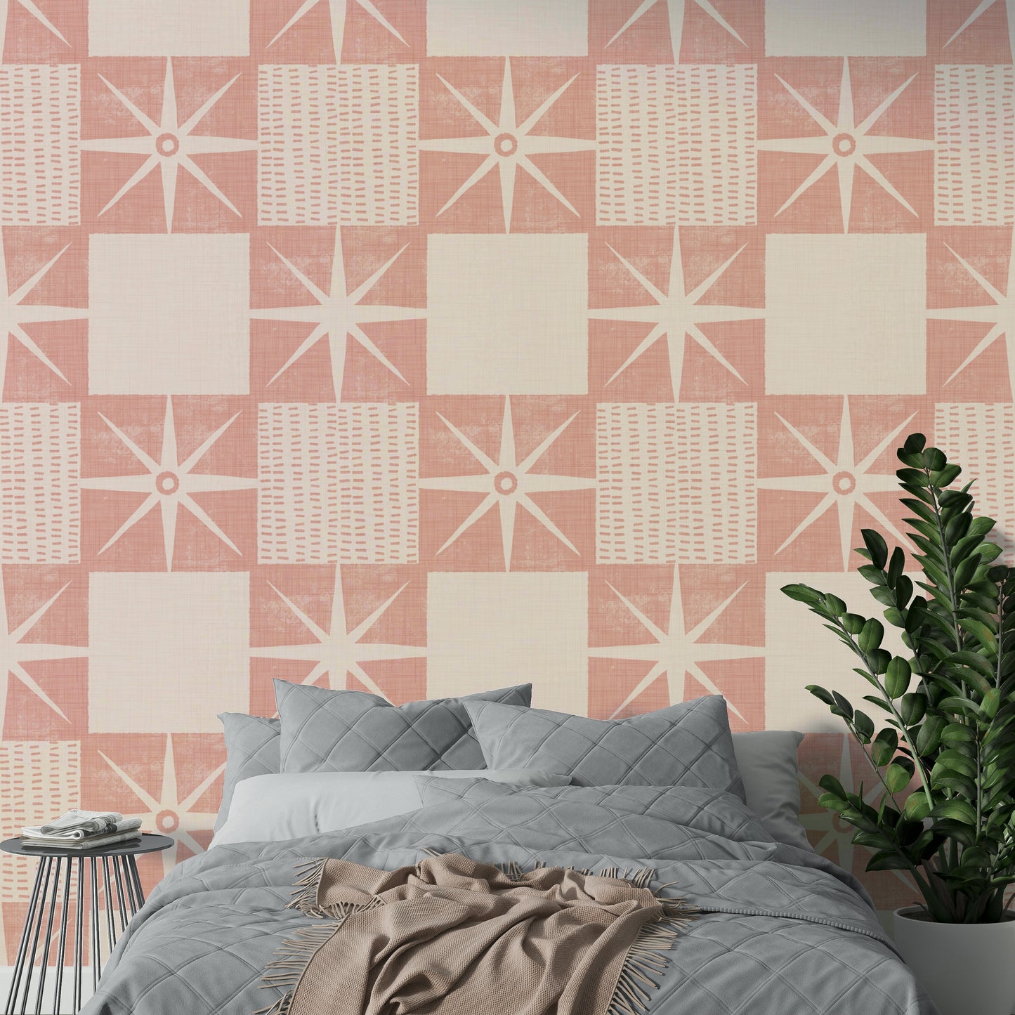 Pink starburst shapes forming a retro quilt block pattern

