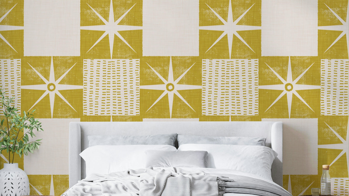 Retro starburst quilt block wallpaper in mustard yellow

