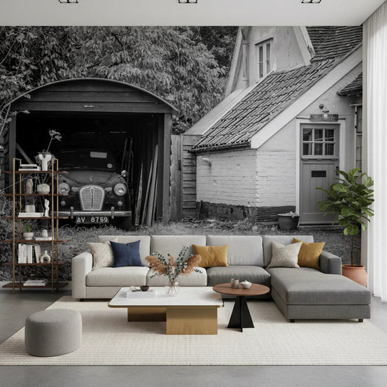 Retro Vehicle Hideaway wallpaper mural of a vintage car in a garage behind a beige and grey sectional in a living room