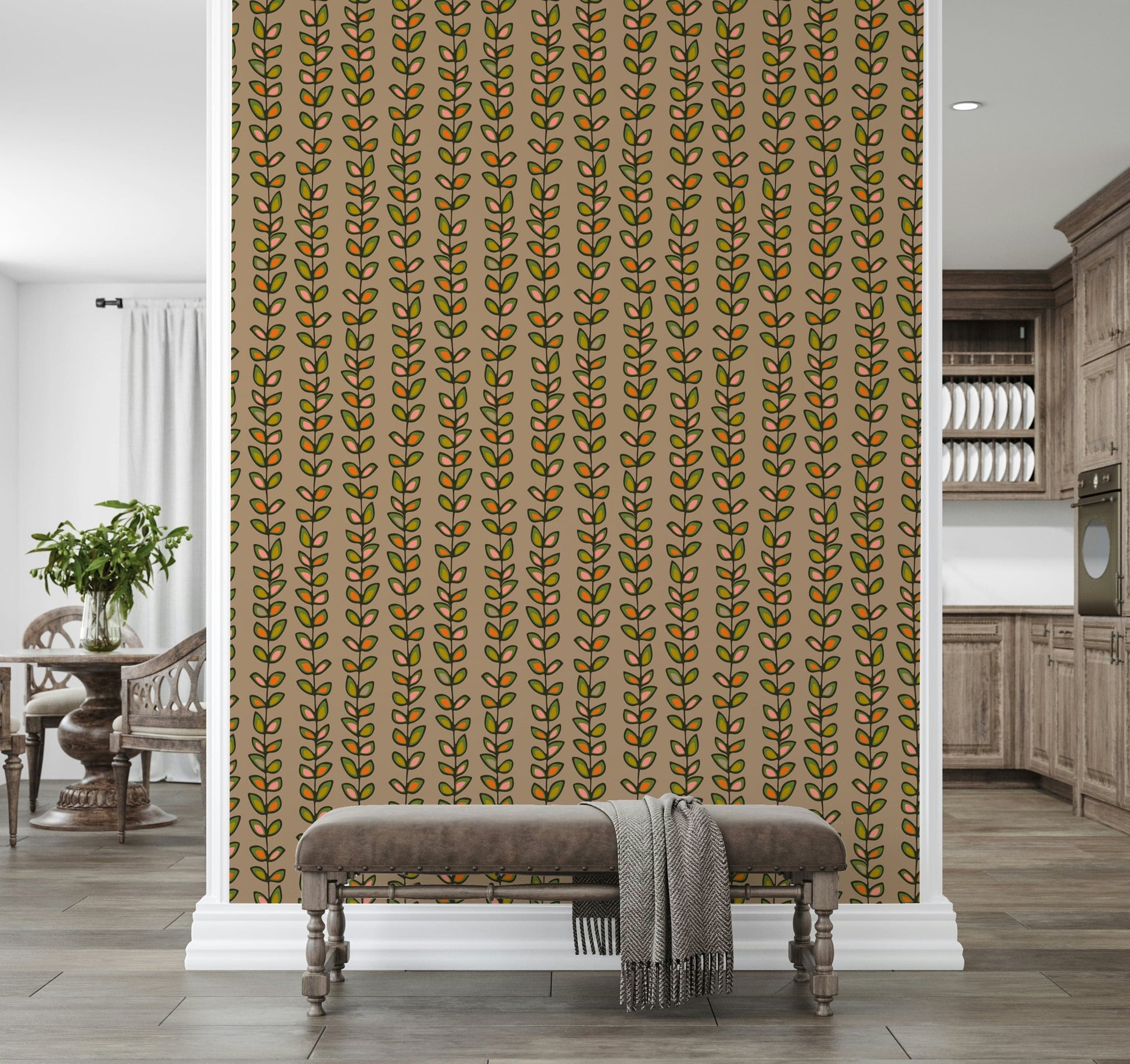 Colorful leaf motifs in orange and green forming playful vertical vine stripes on a beige wallpaper.