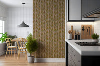 A warm beige wallpaper decorated with repeating retro leaves arranged along thin vertical vines.