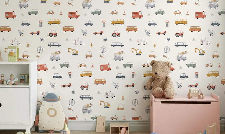 Road Trip Fun Cream background wallpaper mural in a kids room with a white sideboard, pink toy chest and teddy bear
