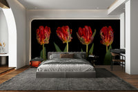 A wall mural of four red tulips.

