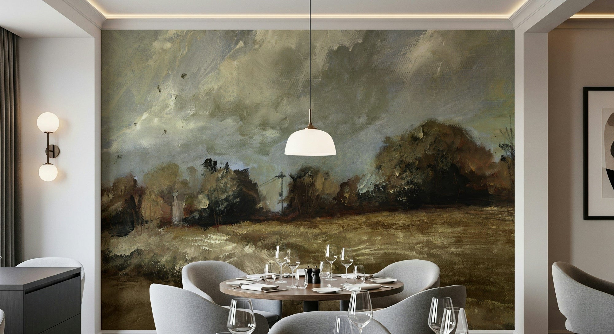 Brushstroke Countryside wallpaper mural of a painted meadow and tree line in a dining room with a round table and grey chairs