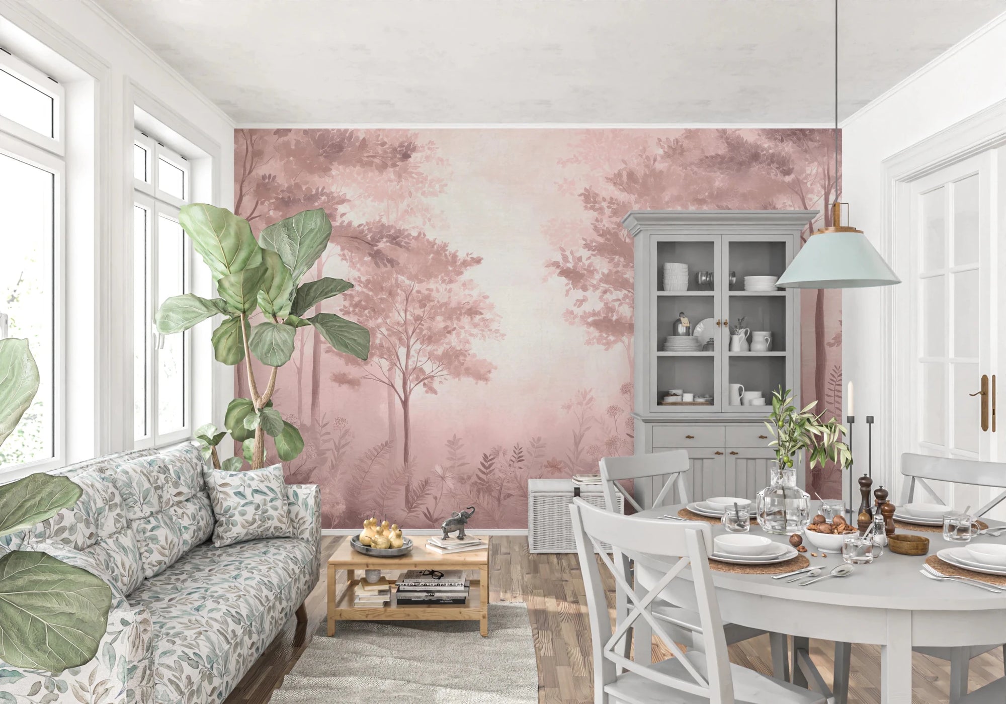 Scandinavian forest dusty rose wallpaper mural of misty pink trees behind a floral sofa in a living and dining room