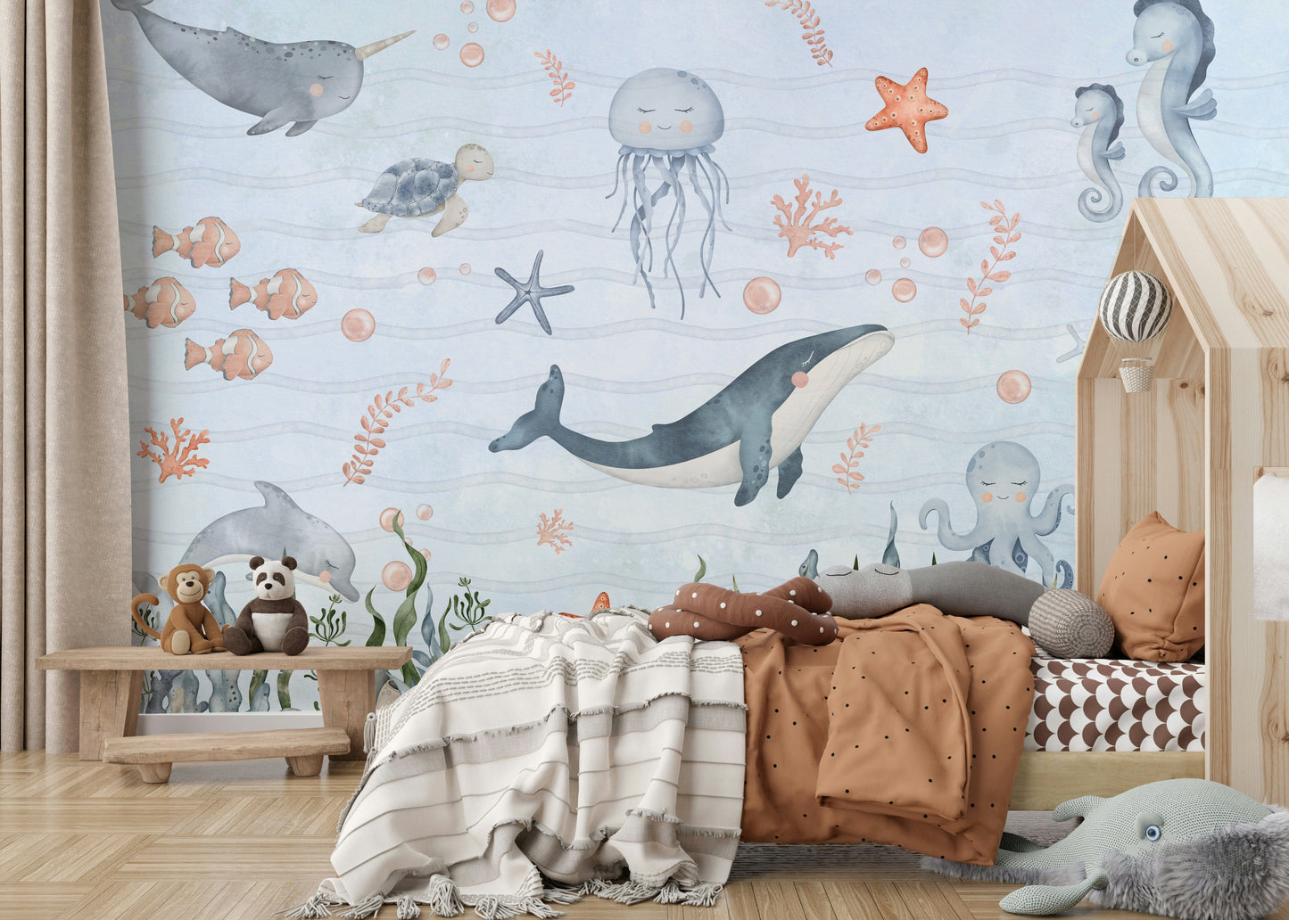 Ocean-themed wall mural for apartment nursery, pastel blue background, gentle illustrations