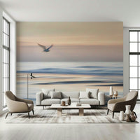 Coastal seagull wallpaper in bedroom, neutral bedding, light blue color palette, feature wall