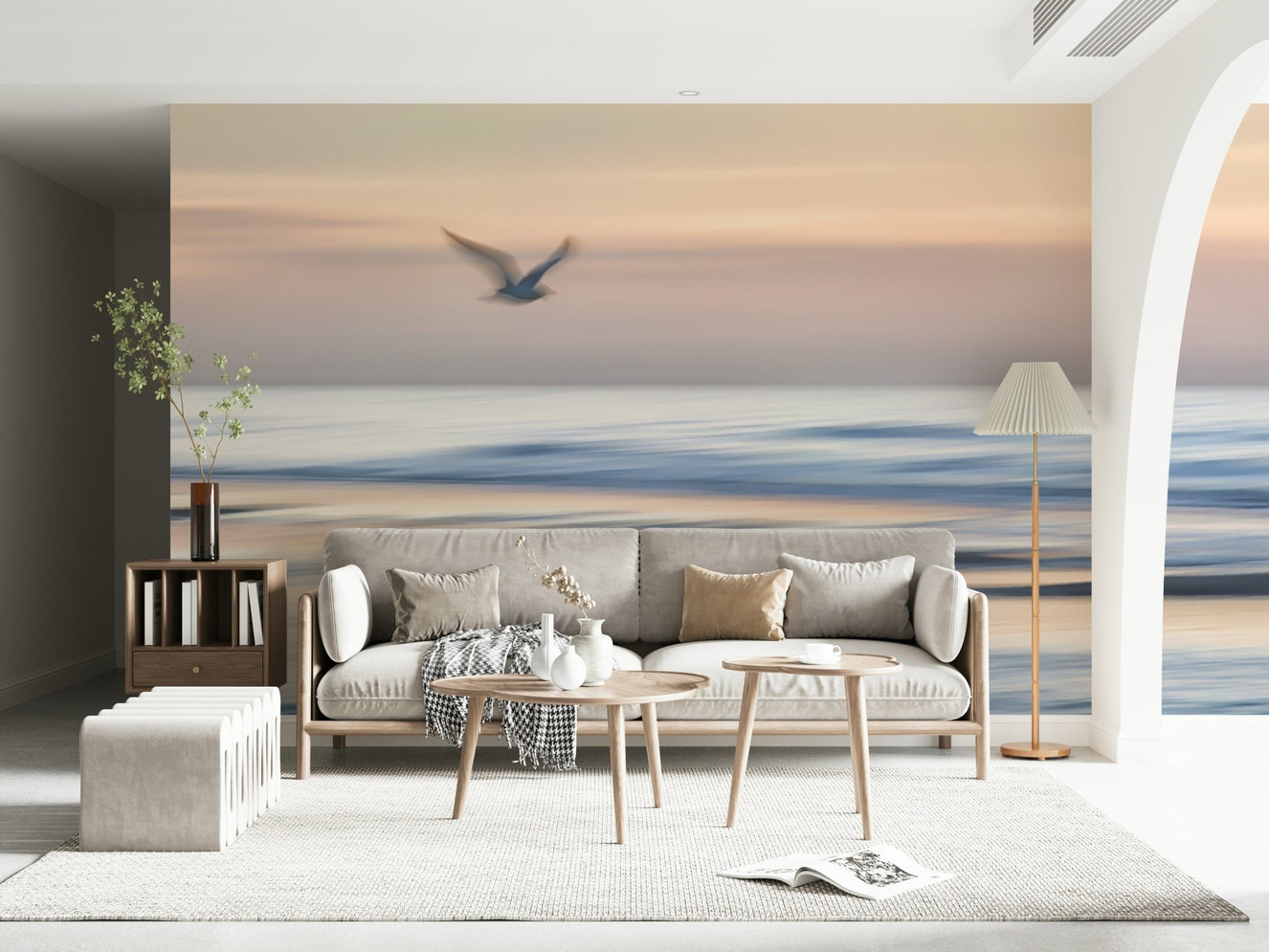 Seagulls in flight over calm ocean wall mural in modern living room, soft blue tones, feature wall