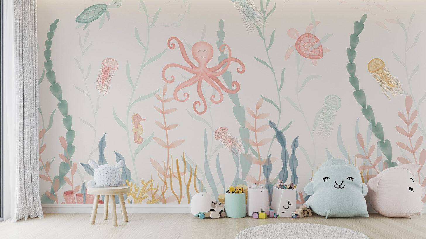 Pastel Marine Symphony wallpaper mural with a pink octopus and seaweed above a wooden stool and cloud cushions in a kids room