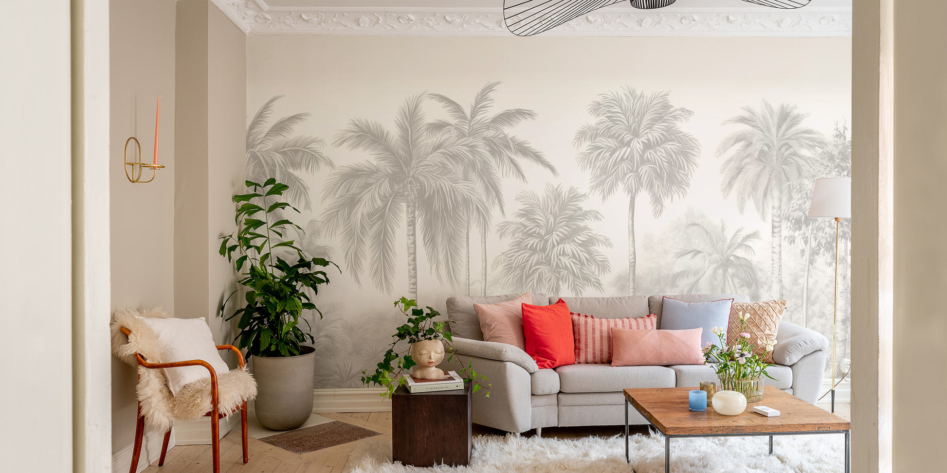 Palm Tree Wall Mural peel and stick in a living room with orange and red pillows for a vibrant tropical display.