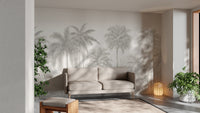 Temporary Palm Tree Wall Mural in a modern living room with a neutral sofa and green plants for a lush atmosphere.