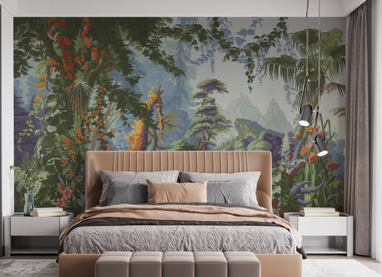 Peaceful Forest wallpaper mural of green jungle foliage and orange blooms behind a tan upholstered bed with grey bedding in a bedroom