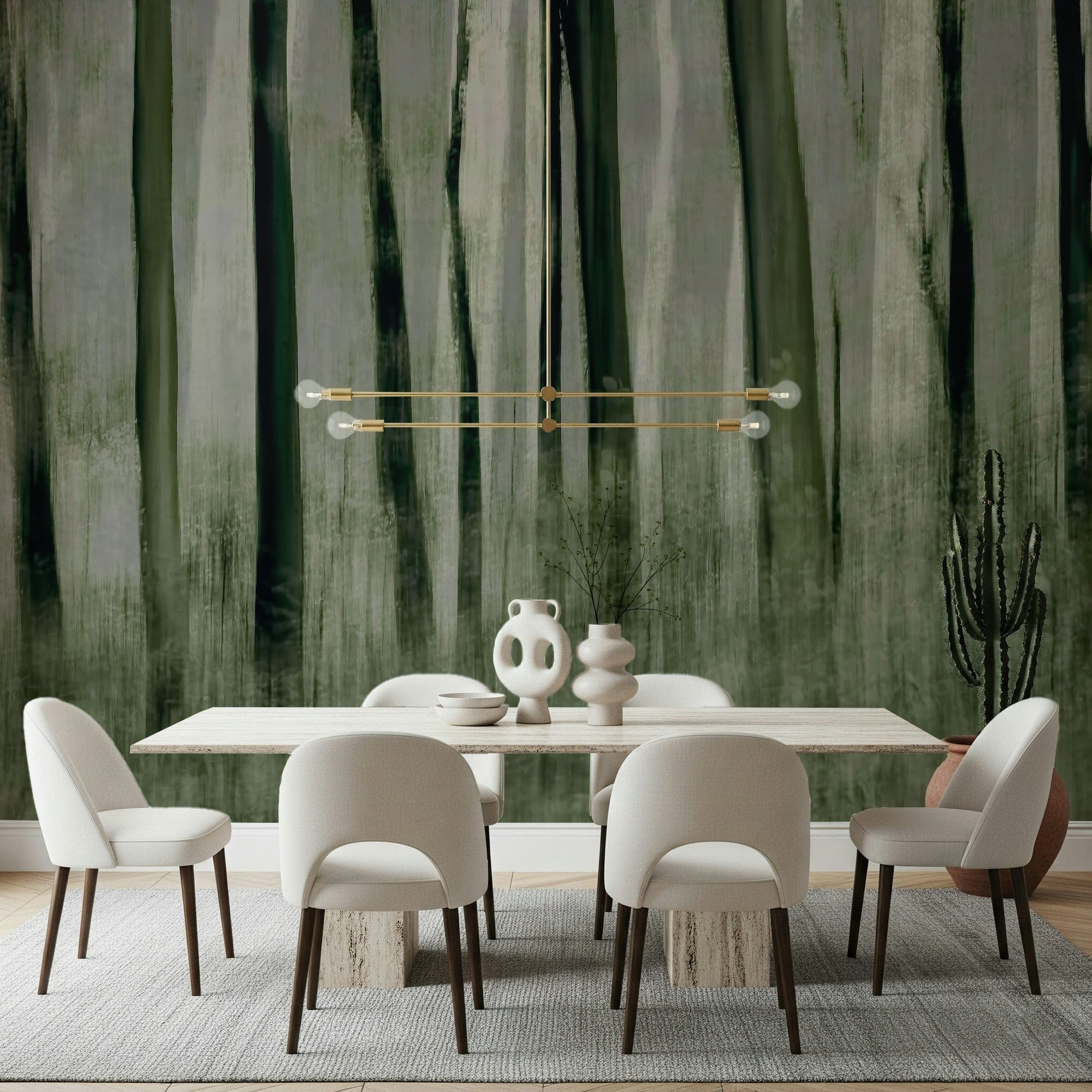Forest Whisper wallpaper mural of misty green tree trunks above a travertine dining table and cream boucle chairs