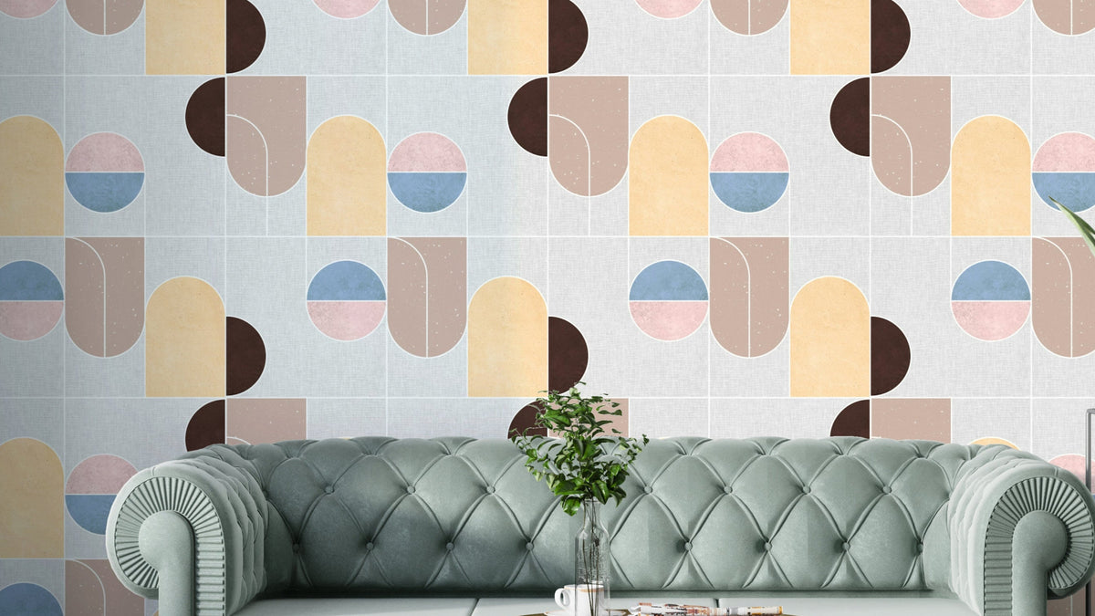 Serene Geometry wallpaper with pastel half-circles and arches above a mint green chesterfield sofa