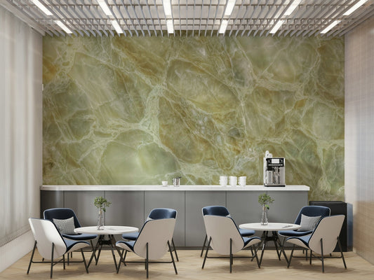 Serene Marble Veins wallpaper mural in green onyx with white veining on a cafe wall above blue and cream chairs