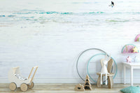 An artistic surfer silhouette mural on scenic wallpaper.

