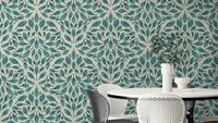 Botanical wallpaper featuring soft teal leaves

