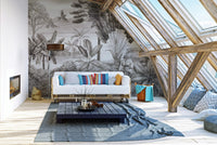 Shooter sitting in jungle wallpaper mural for adventurous decor.
