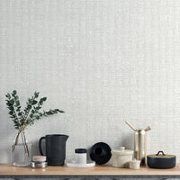 Light grey wallpaper mural showcasing white grid patterns.
