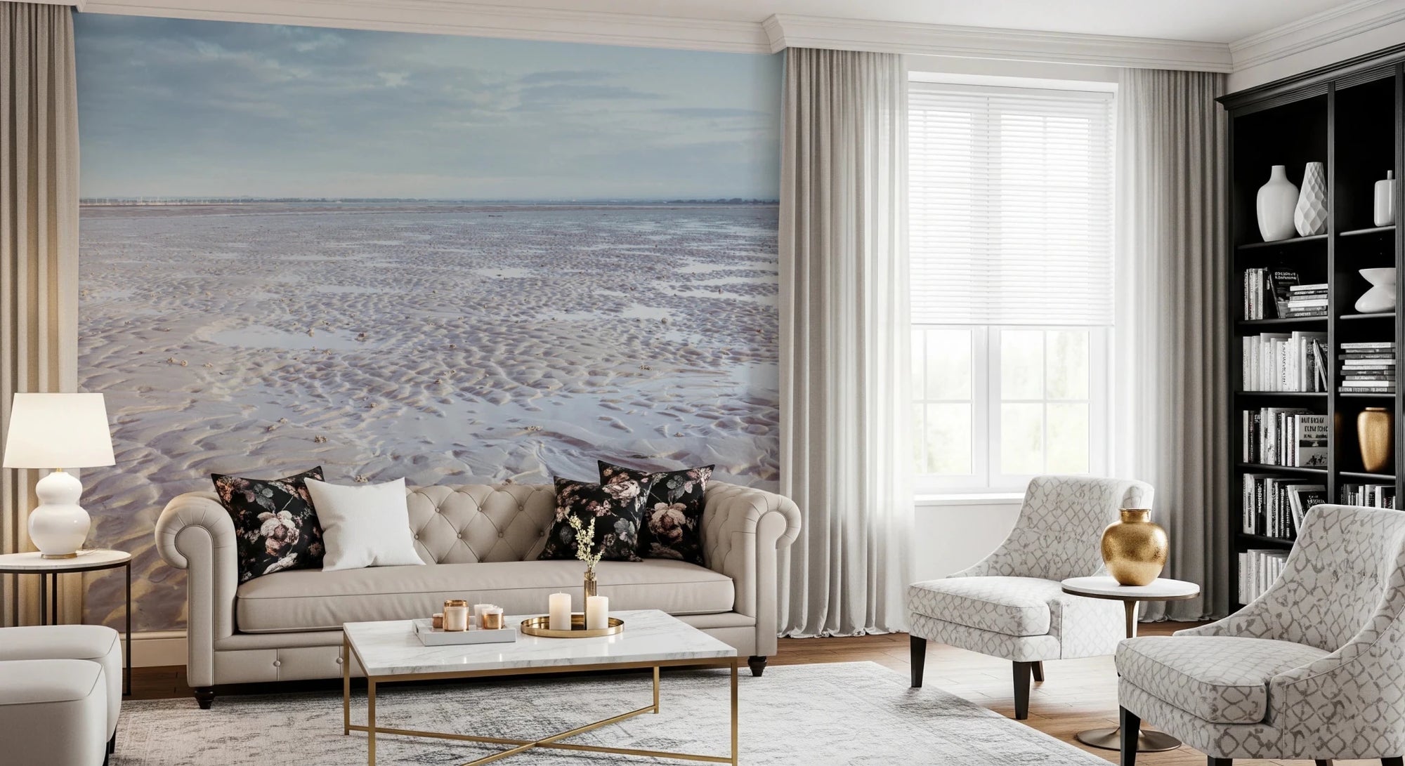 Shoreline Serenity wallpaper mural of a calm rippled sand beach behind a cream tufted Chesterfield sofa with floral cushions