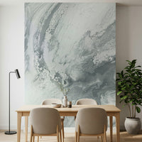Textured wall mural with flowing silver designs creating a dynamic and stylish accent wall.