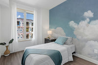 Close-up of soft white wallpaper with subtle blue cloud design
