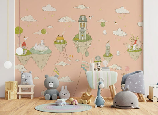 Skyborne Homes wallpaper mural of peach floating islands behind a grey teddy and whale chair with a blue rug