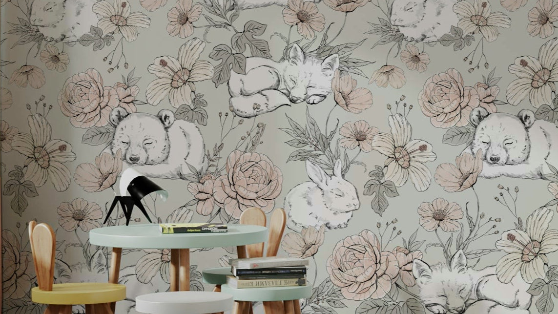 Sleeping Woodland Sage Green wallpaper with snoozing bears, foxes and rabbits behind a kids play table and bunny-ear chairs