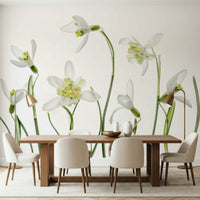 A graceful subtle bloom wall mural in cool, white tones.

