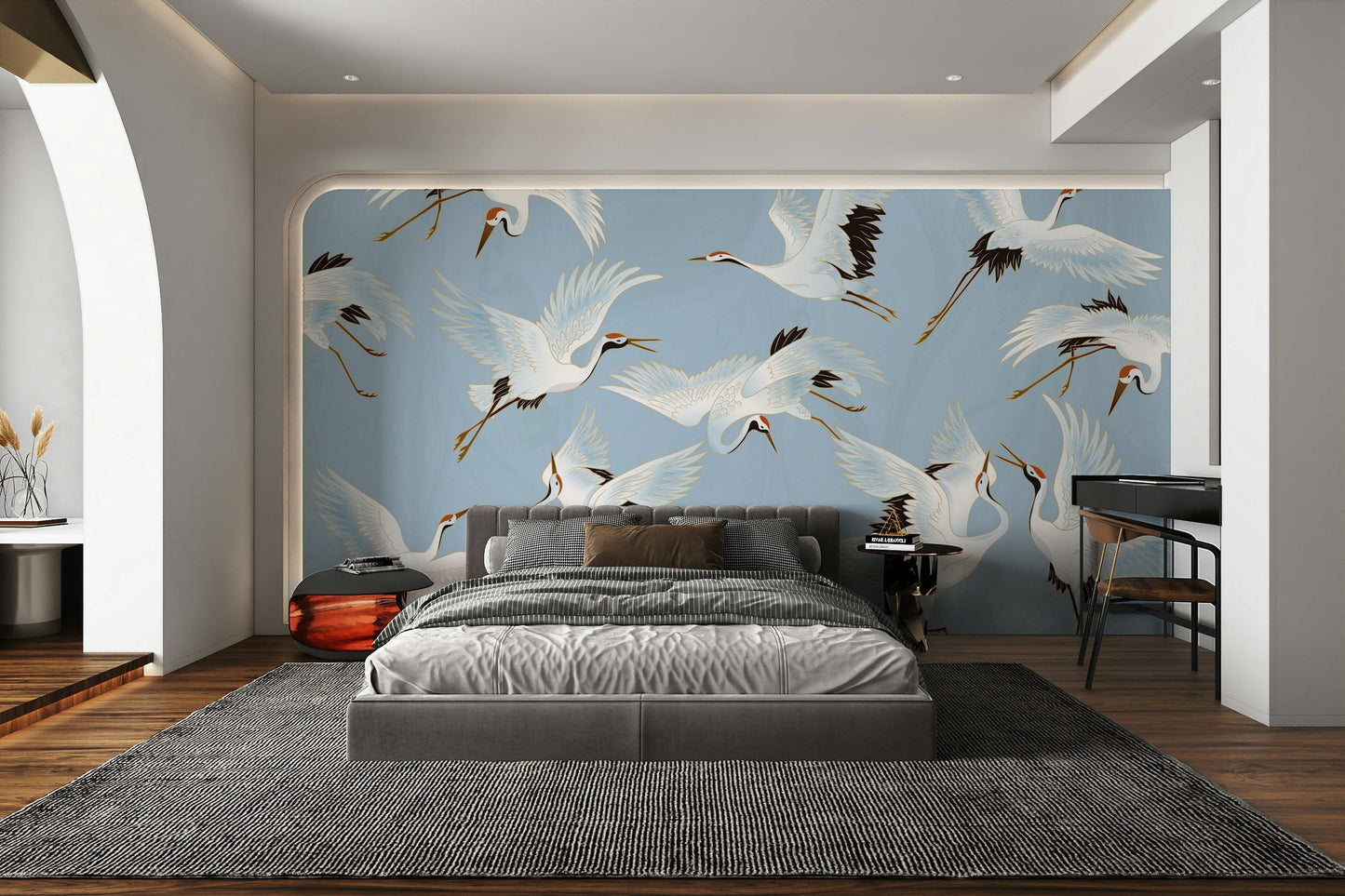 The design features elegant cranes soaring through the air.

