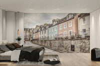 Pastel-colored homes on a cobblestone street

