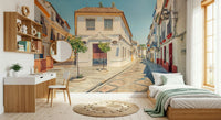 Spanish Street Charm sunny cobblestone alley wallpaper for walls.