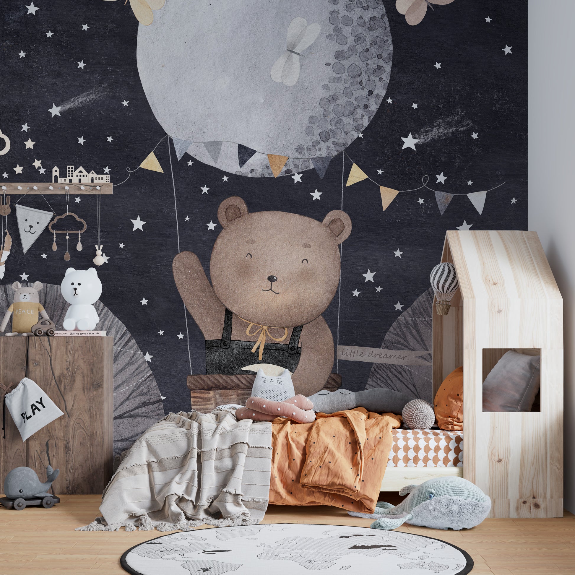 Cute bear and balloon mural under a sparkling starry night sky.

