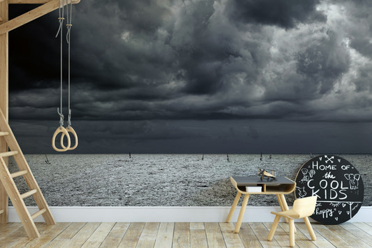A beautiful coastal rock wallpaper mural with crashing waves.

