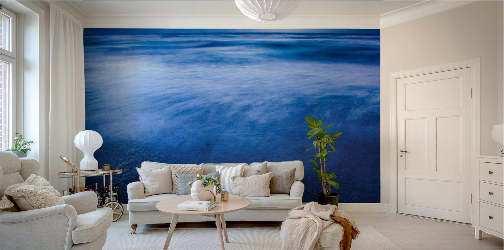 A calming beach scene wallpaper mural that defines a space.

