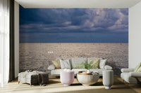 An artistic seaside view mural on minimalist wallpaper.

