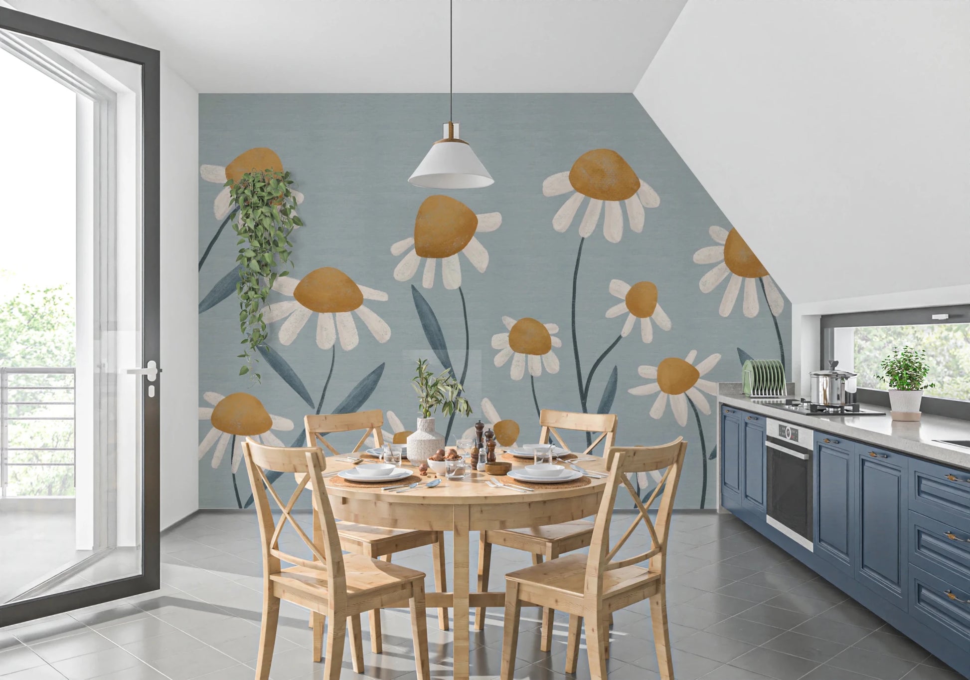 Sunny Daisy Field wallpaper mural of daisies on blue-grey behind a wood dining table in a kitchen with navy cabinets
